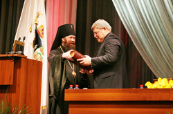 His Holiness Rostislav is congratulating the new 
Governor